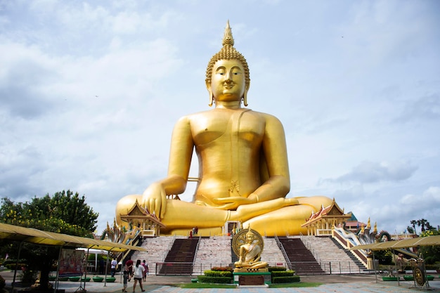 Ancient golden big buddha statue for thai people travelers travel visit and respect praying blessing wish holy mystery of Wat Muang temple at Angthong city on October 31 2023 in Ang Thong Thailand