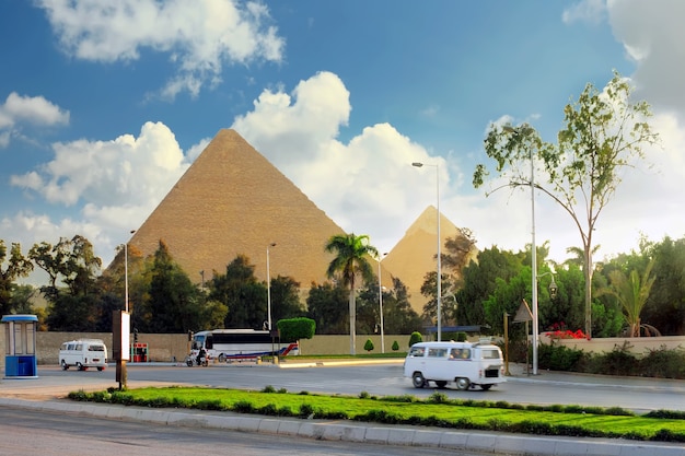 Ancient Great Pyramids and present day of Giza town,suburb of Cairo city.  Egypt.