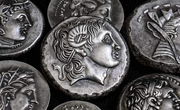 Ancient Greek coins closeup portrait of Alexander the Great in center