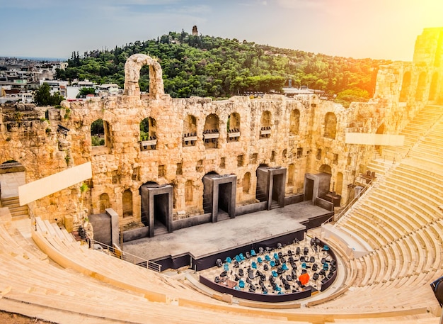 Ancient Herodes Atticus amphitheater with the cityscape on the background