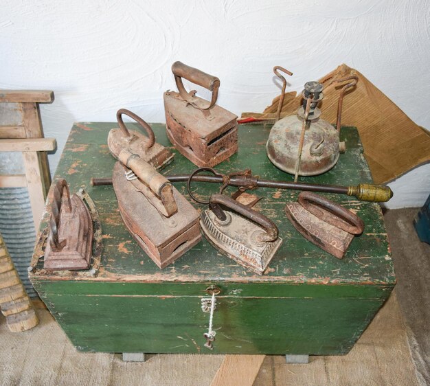 Ancient irons on a timber floor Reconstruction of life of Cossacks of Kuban