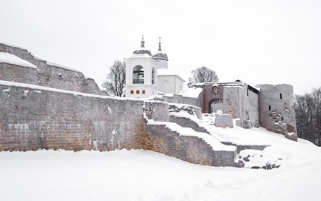 Ancient Izborsk fortress in winter with Church
