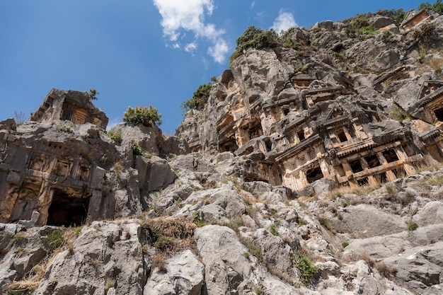 Ancient lycian necropolis with tomb carved in rocks in Mira Demre Turkey