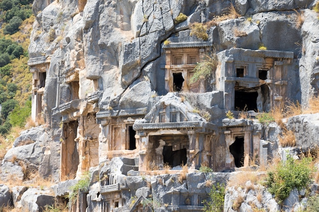 Ancient lycian necropolis with tomb carved in rocks in Mira