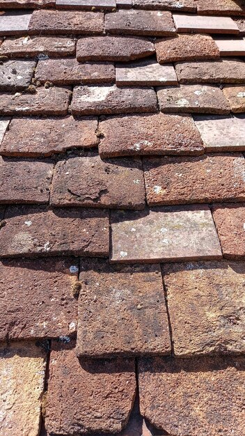 Ancient medieaval roof tile on old vintage house