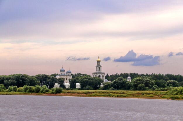 An ancient monastery in the forest by the river Yuryev monastery in Novgorod