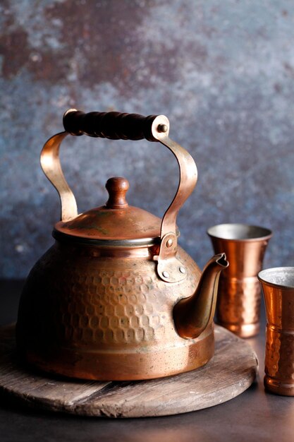 ancient moroccan tea pot on wooden tray