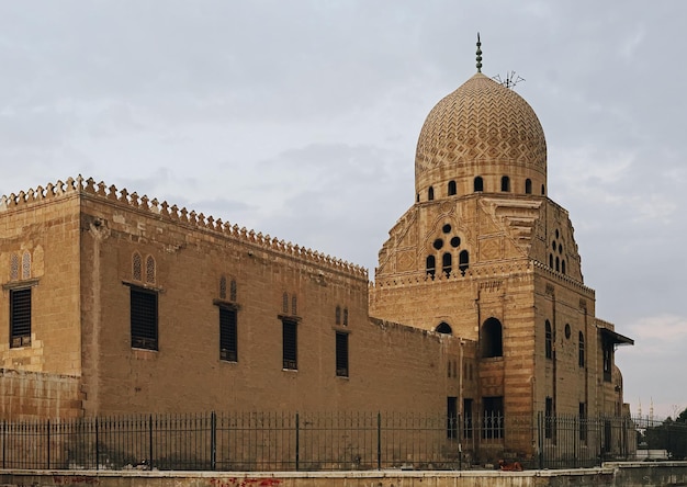 Ancient mosque building in city of dead and cemetery at old Cairo, Egypt
