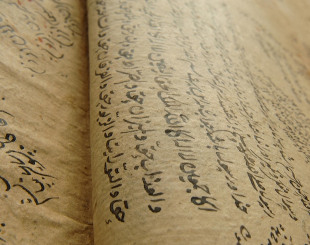 Ancient open book in arabic. Old arabic manuscripts and texts