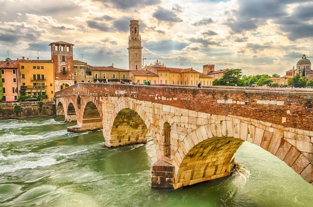 Ancient Roman Bridge called Ponte di Pietra above the Adige River in Verona Italy