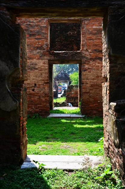 Ancient ruins brick building and antique architecture of official residence of ambassador home or Wichayen house for thai people and foreign traveler travel visit at Lopburi city in Lop Buri Thailand