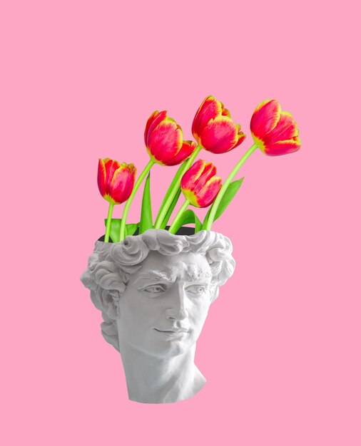 写真 ピンクの背景に花が生えている古代の像の胸像 メンタルヘルスコラージュ
