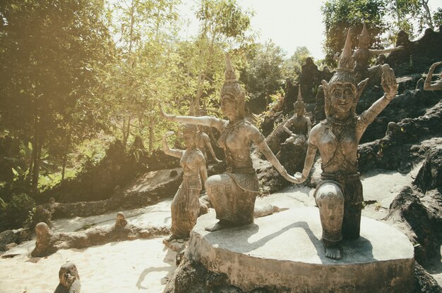 Ancient stone statues in Secret Buddhism Magic Garden, Koh Samui, Thailand. A place for relaxation and meditation.