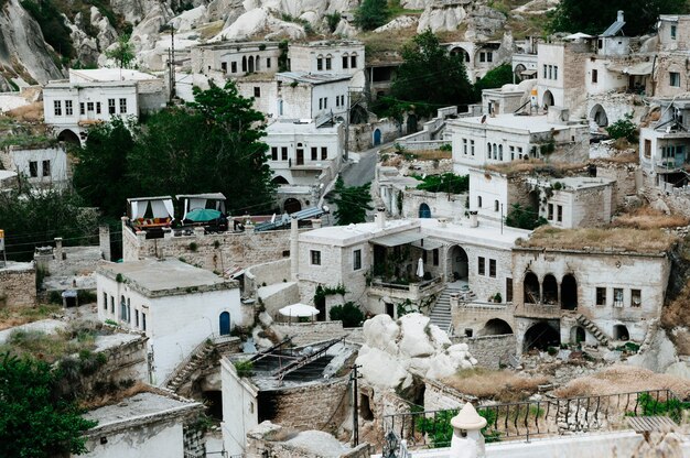 Ancient town and a castle of Uchisar dug from a mountains after sunrise, Cappadocia, Turkey