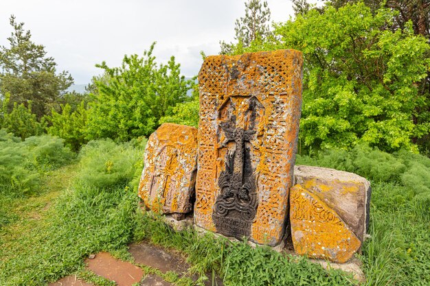 Ancient traditional carved khachkar or crossstone installed near Sevanavank monastery Armenian history and heritage art