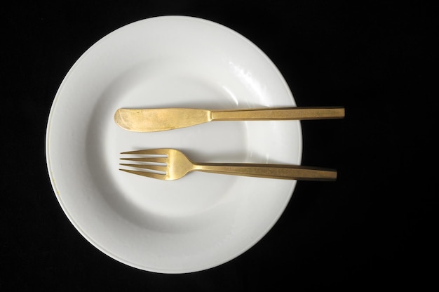 Ancient Vintage Silver Flatware on a Black Background