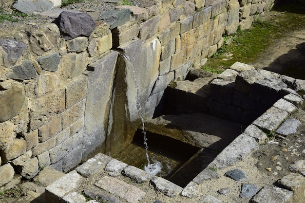 Ancient water source in Inca ruins of Ollantaytambo Peru Ancient building in Sacred Valley in Peruvian Andes