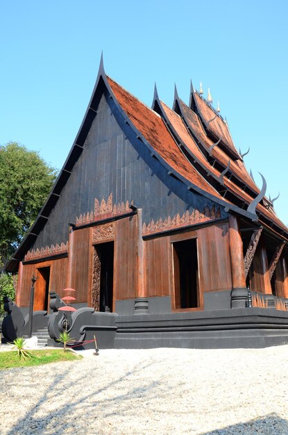 Photo ancient wood building baandam museum of thawan duchanee or antique art wooden architecture black house baan dam gallery for thai people and foreign travelers travel visit in chiang rai city thailand