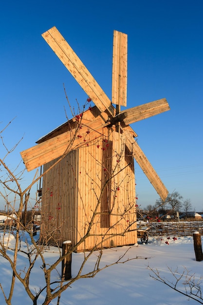 Ancient wooden windmill in the village of Pustovoitovka Sumy region Ukraine