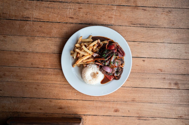 Andean food plate served on a white plate on a wooden table