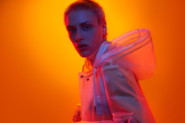 Androgynous model under neon light