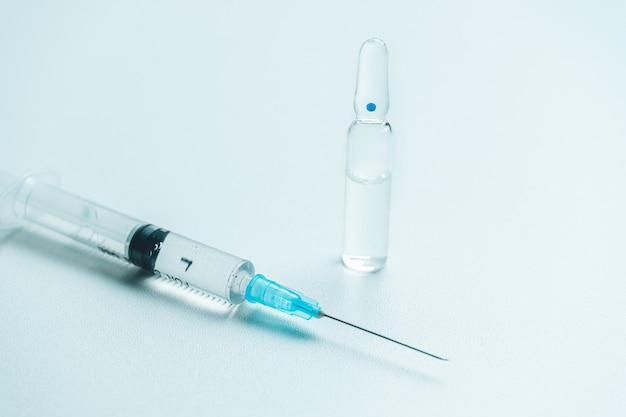 Anesthesia medicine in glass ampoule and syringe.