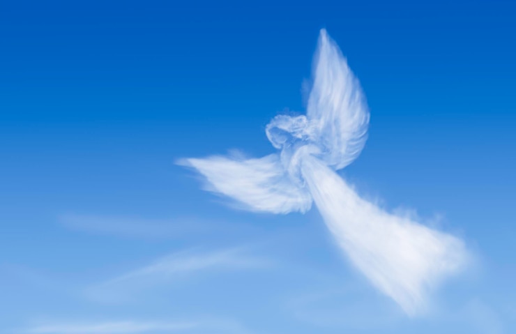 Photo angel in the sky. angel shaped cloud
