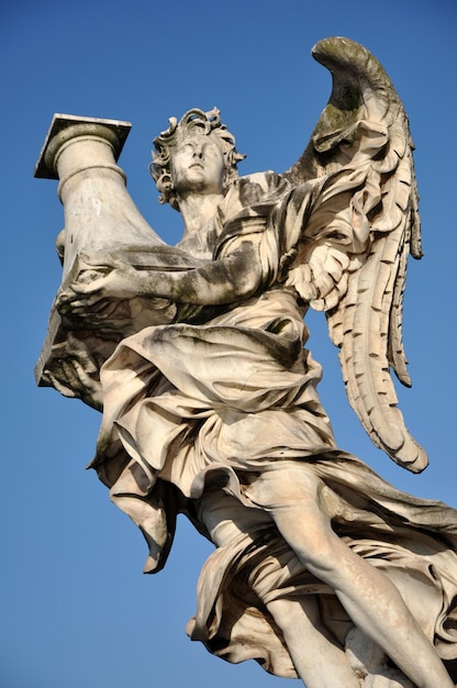 Angel statue against blue sky Rome Italy