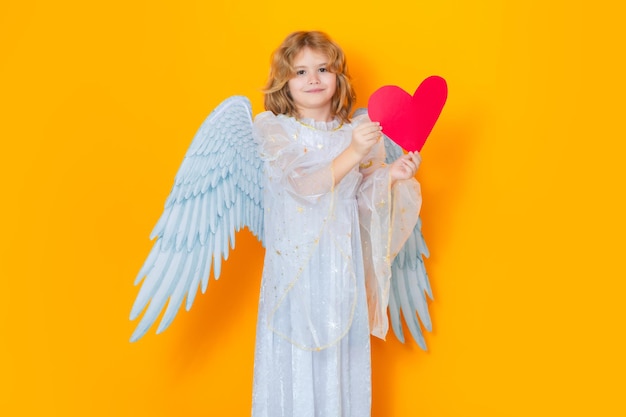 Angel with heart kid wearing angel costume white dress and feather wings innocent child