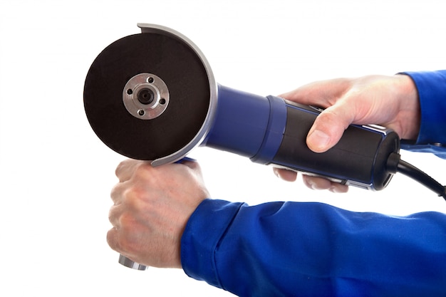 Angle grinder in hands