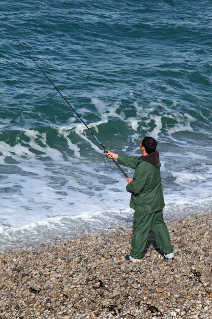 Angler at seaside