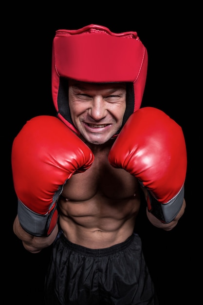 Angry boxer with gloves and headgear