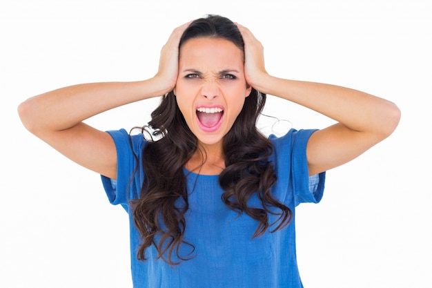 Angry brunette shouting at camera