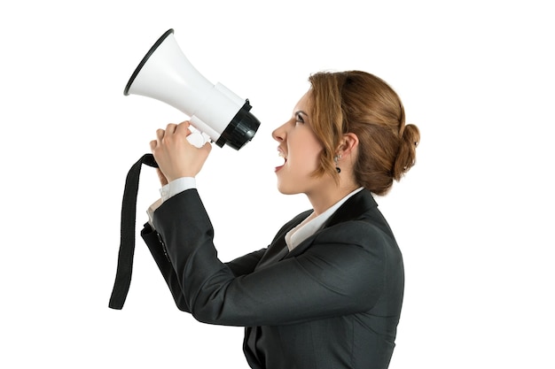 Angry business woman shouting with a megaphone