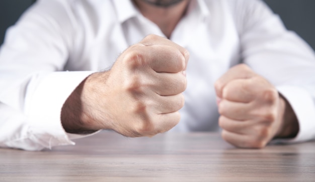 Angry businessman showing his fists.