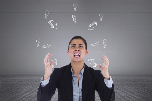 Angry businesswoman gesturing against grey room with arrows