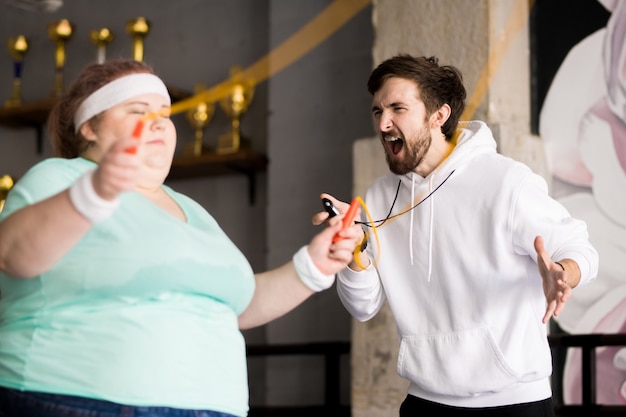 Angry Coach Yelling at Obese Woman