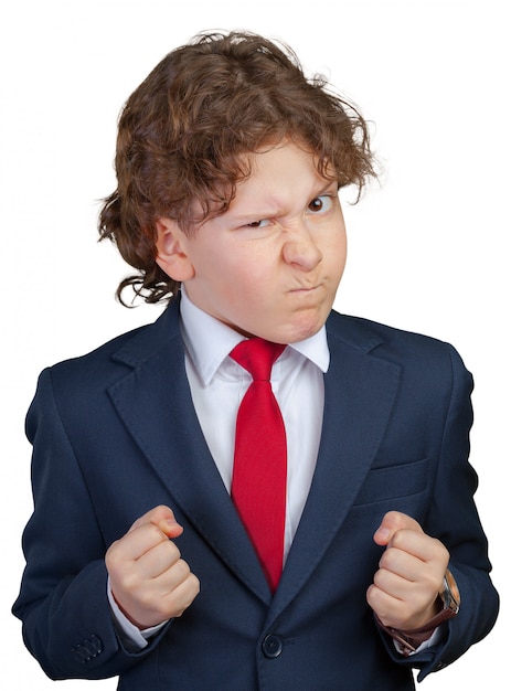 Angry curly boy in a formal suit