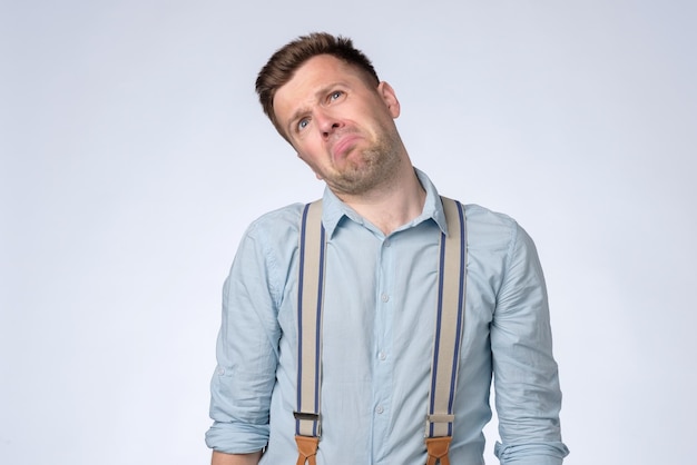 Angry emotion on face of young man Man is about to start crying