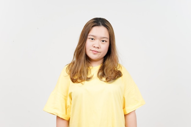 Angry face expression of Beautiful Asian Woman wearing yellow TShirt Isolated On White Background