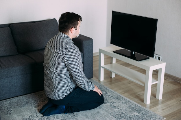 Angry hipster man watching tv news