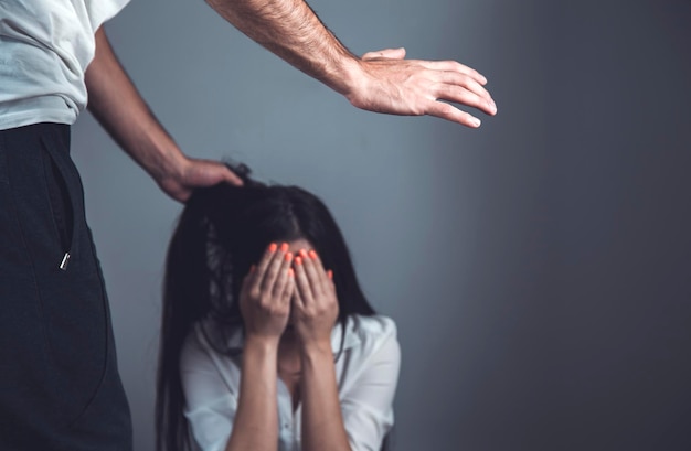 angry man beat sad woman