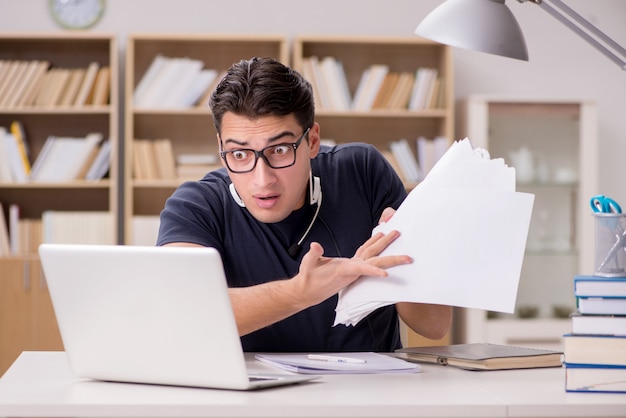 Angry man with too much paperwork to do