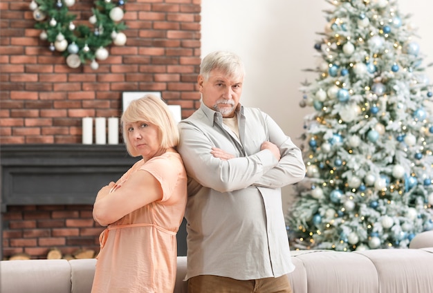 Angry mature couple at home