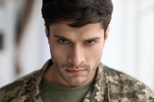 Angry military man looking at camera closeup shot