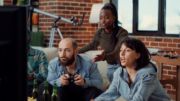 Angry people losing video games challenge on tv console,
feeling frustrated about lost gaming competition. playing online
game and being sad about lose, group leisure activity.