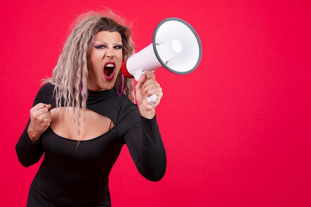 Photo angry transgender person shouting using a loudspeaker