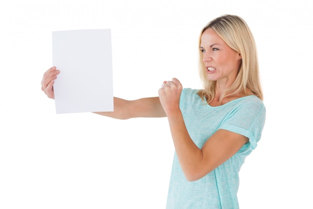 Angry woman holding piece of paper