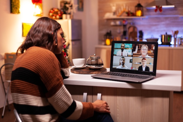 Photo angry woman meeting colleagues on video call