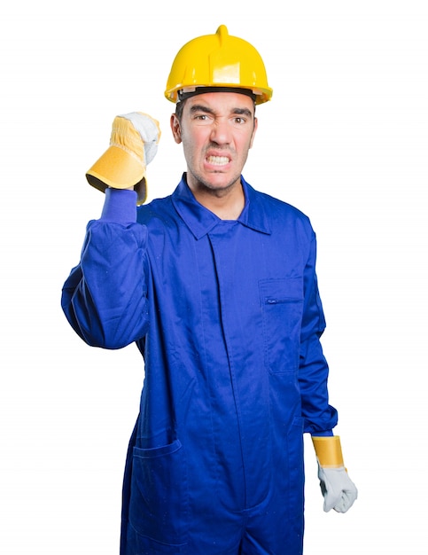 Angry workman on white background